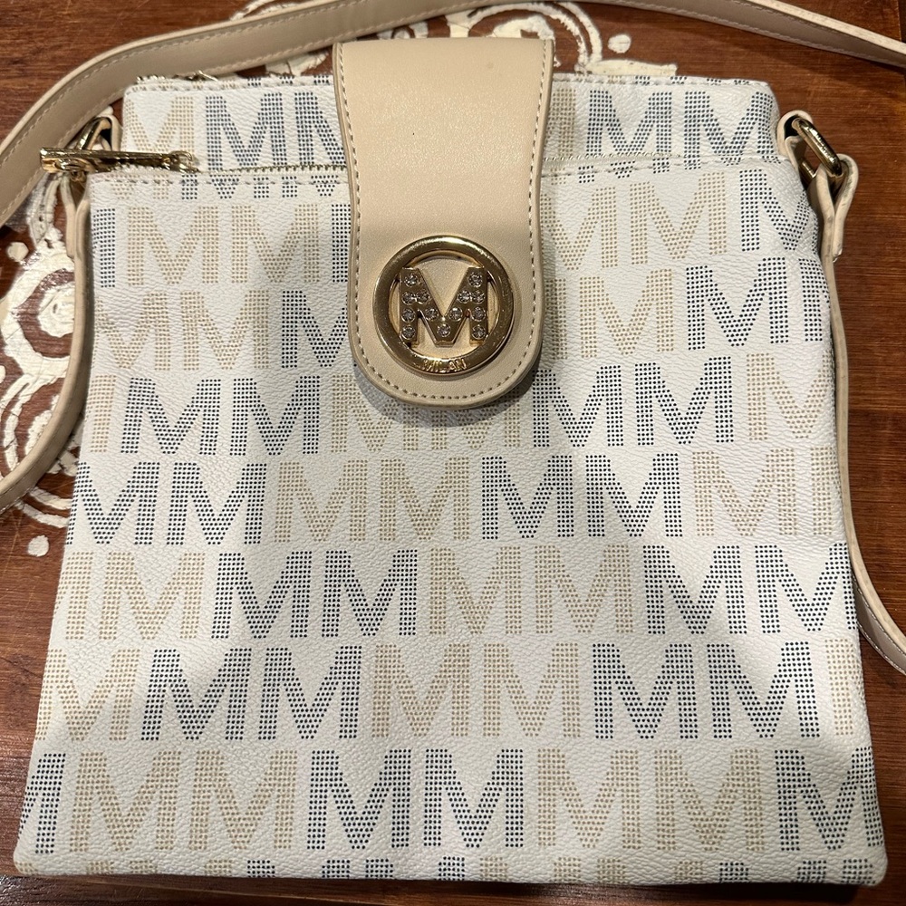 MKF ladies crossbody purse. White beige and black with 2 zippered compartments